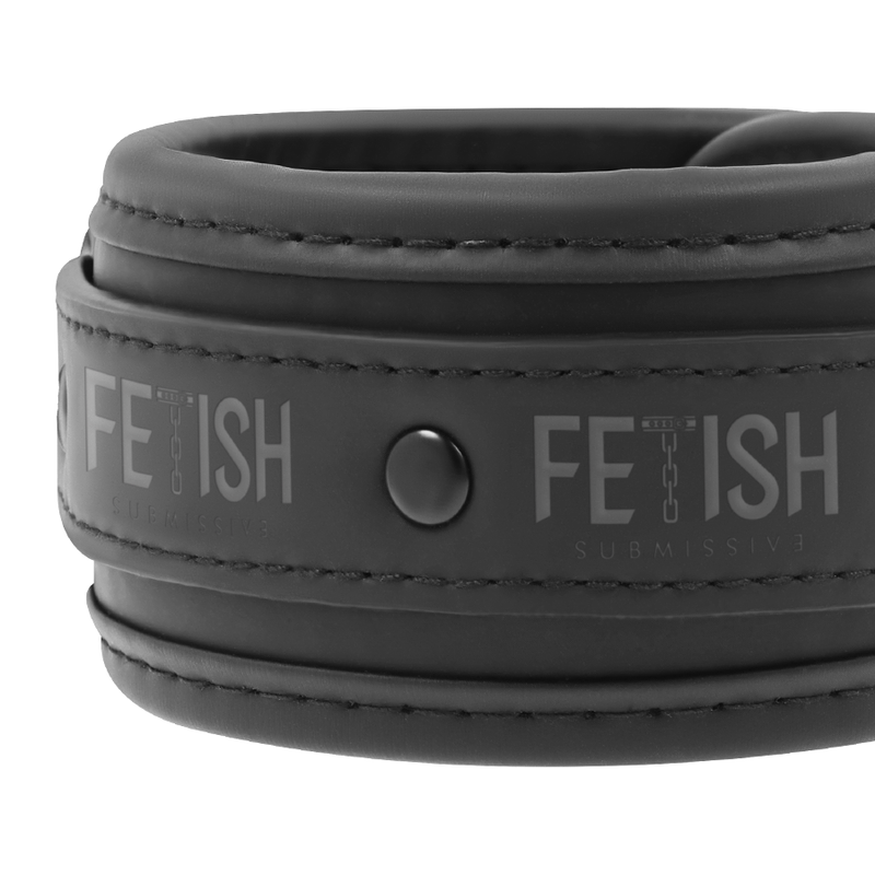 Detail of D-ring strap on Fetish Submissive handcuffs, designed for secure attachment in bondage scenes.